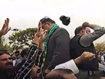 PTI workers throw a shoe on PML-N leader Ahsan Iqbal